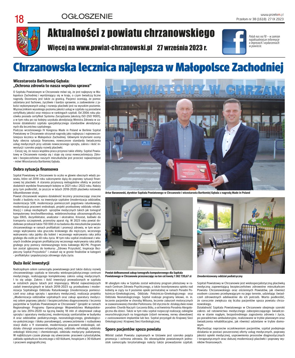 Makieta gazety ze zdjęciem dwóch mężczyzn trzymających pamiąkową paterę 
